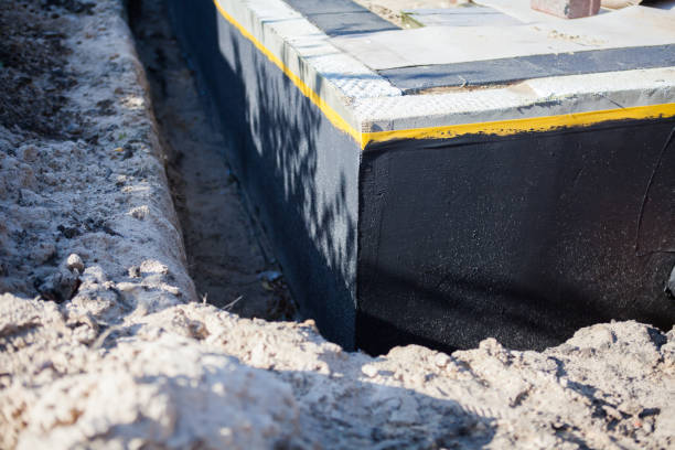 Professional Waterproofing technician working in Tuscaloosa, AL